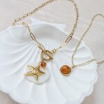 Wakacyjny naszyjnik z rozgwiazdą i bursztynem Wakacyjny naszyjnik z rozgwiazdą i bursztynem